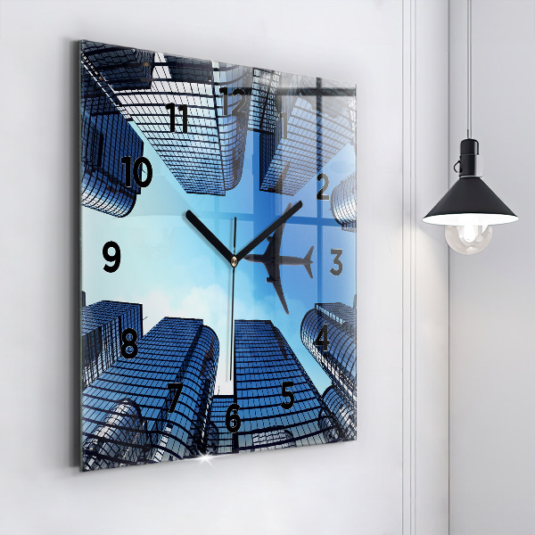 Square glass wall clock Airplane over buildings