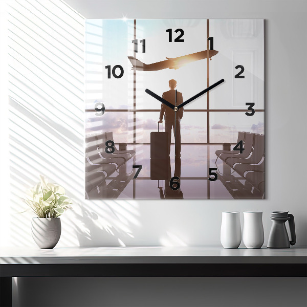 Square glass wall clock Man at the airport