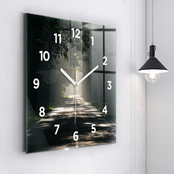 Square glass wall clock Forest road and streaks of sunlight