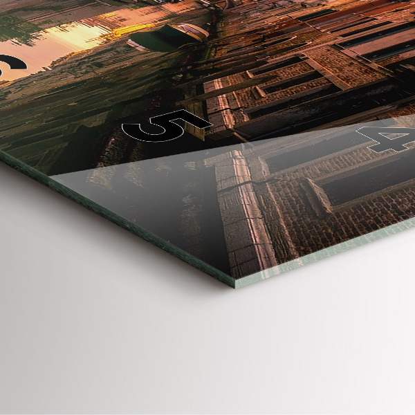 Square glass wall clock View of the canal in the city