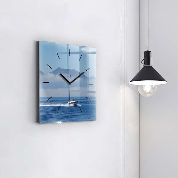Square glass wall clock A boat floating on the ocean