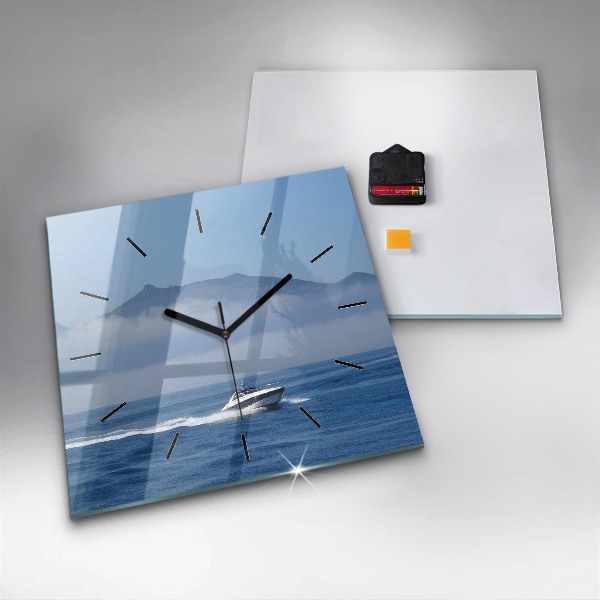 Square glass wall clock A boat floating on the ocean