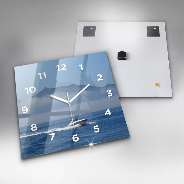 Square glass wall clock A boat floating on the ocean
