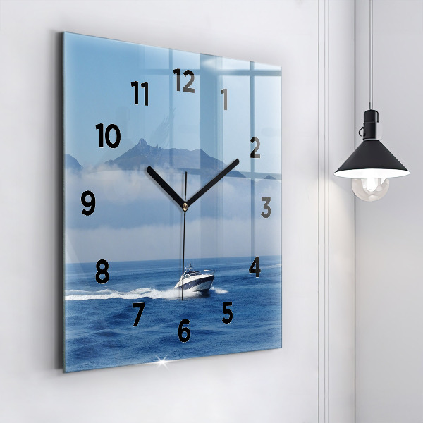 Square glass wall clock A boat floating on the ocean