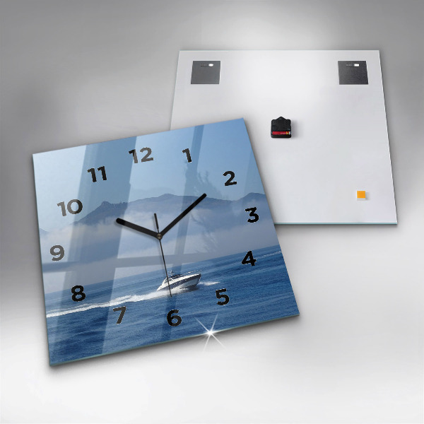 Square glass wall clock A boat floating on the ocean