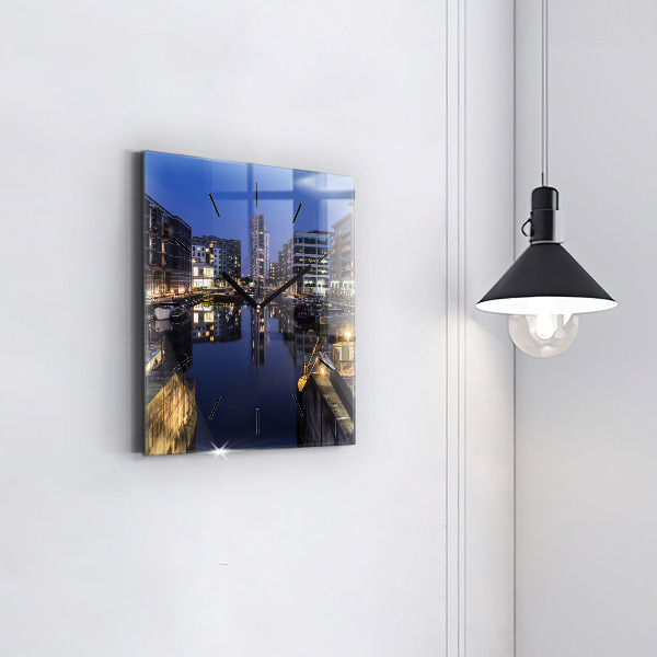 Square glass wall clock The city lit up at night