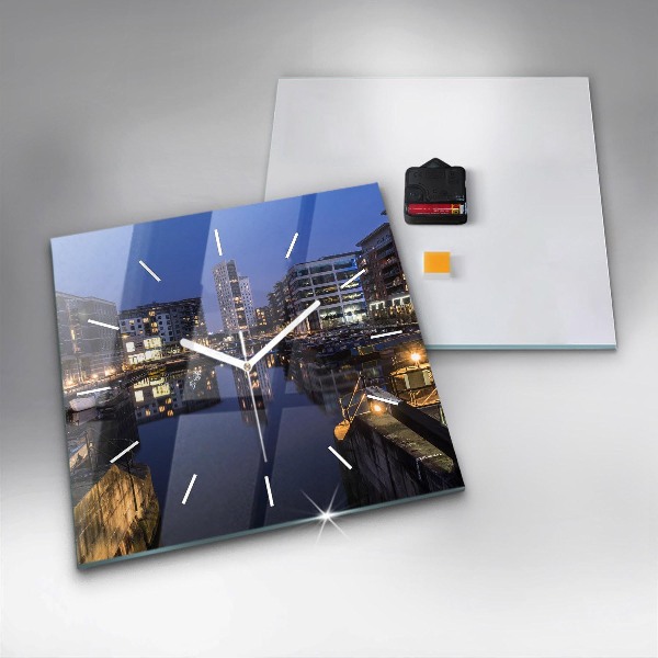 Square glass wall clock The city lit up at night