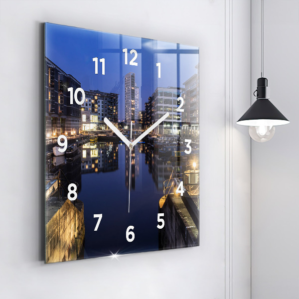 Square glass wall clock The city lit up at night