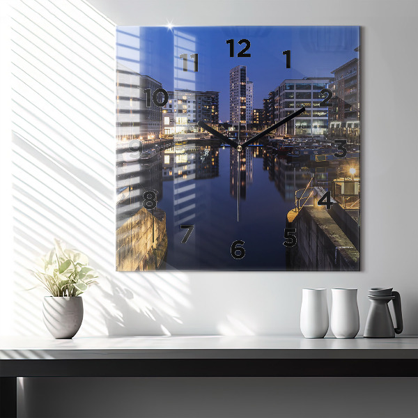 Square glass wall clock The city lit up at night