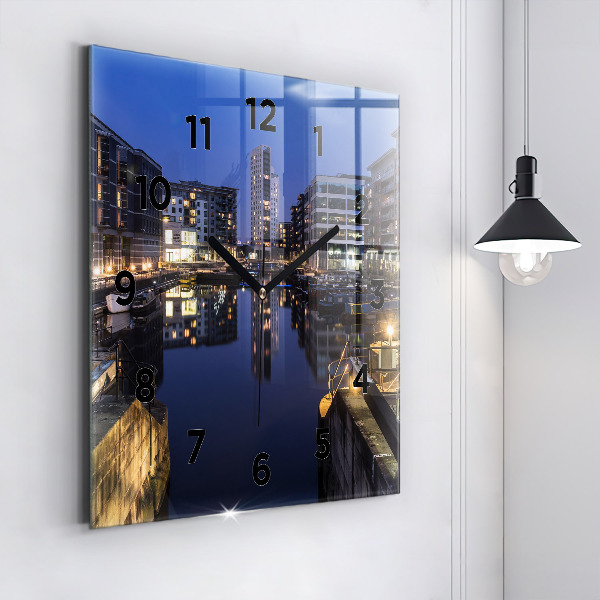 Square glass wall clock The city lit up at night