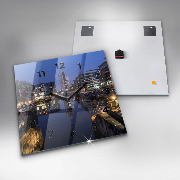 Square glass wall clock The city lit up at night