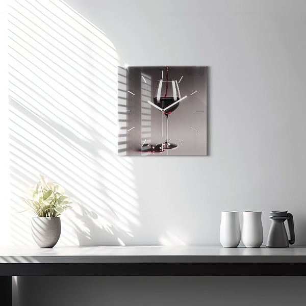 Square glass wall clock A glass of red wine