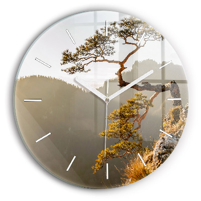 Round glass clock A tree in the mountains