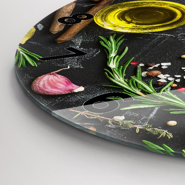 Round glass clock Spices on the counter