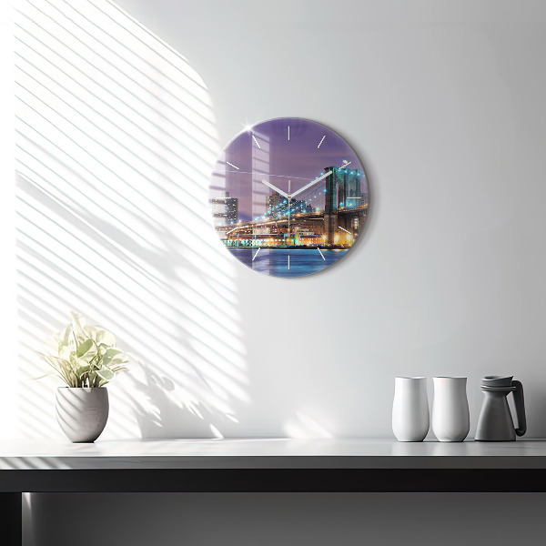 Round glass clock Brooklyn Bridge and East River