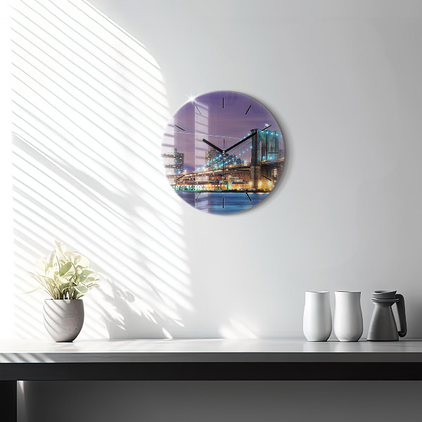 Round glass clock Brooklyn Bridge and East River