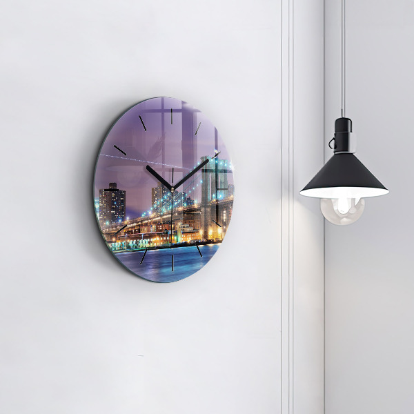 Round glass clock Brooklyn Bridge and East River