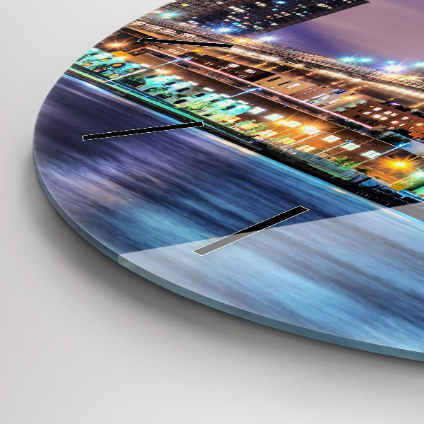 Round glass clock Brooklyn Bridge and East River
