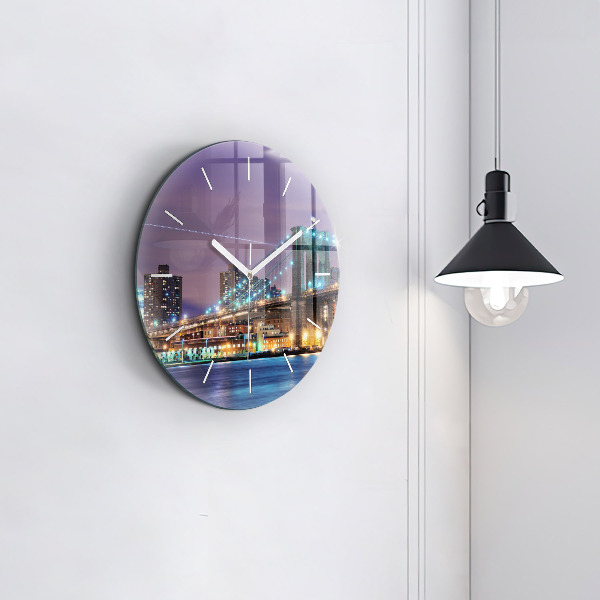 Round glass clock Brooklyn Bridge and East River