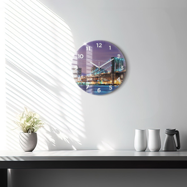 Round glass clock Brooklyn Bridge and East River