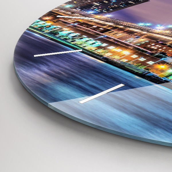 Round glass clock Brooklyn Bridge and East River