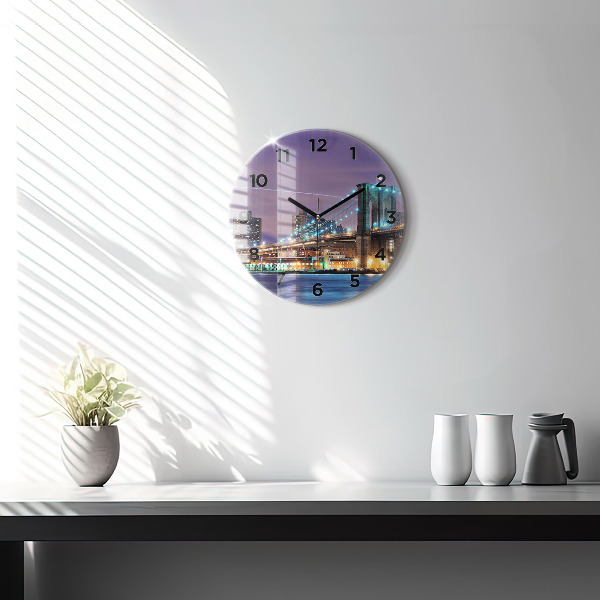 Round glass clock Brooklyn Bridge and East River
