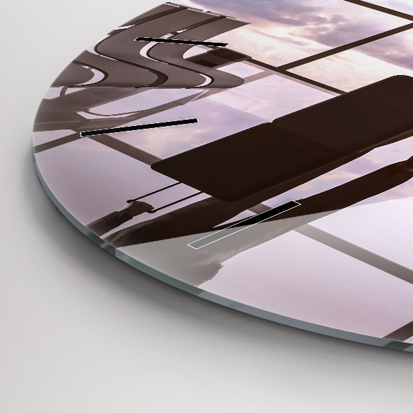 Round glass clock Man at the airport