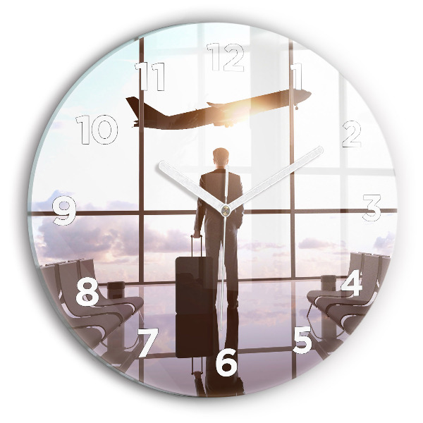 Round glass clock Man at the airport