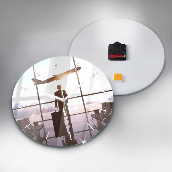 Round glass clock Man at the airport