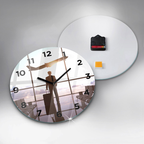 Round glass clock Man at the airport