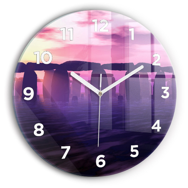 Round glass clock Sunset at Stonehenge