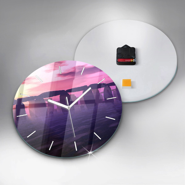 Round glass clock Sunset at Stonehenge