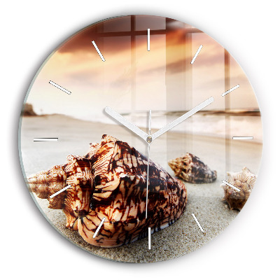 Round glass clock A shell on the beach