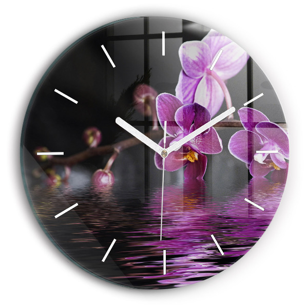 Round glass clock Orchid flower on the water