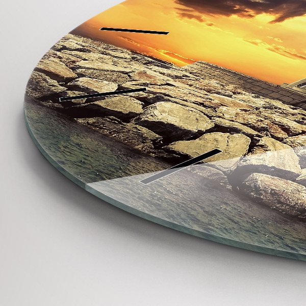 Round glass clock Lighthouse on the water
