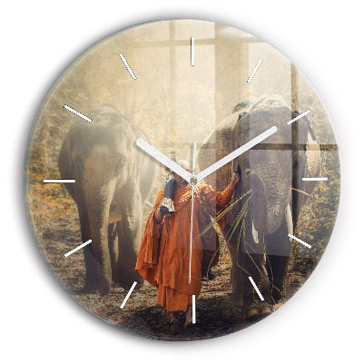 Round glass clock Monk leading elephants