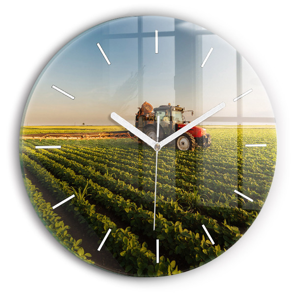 Round glass clock Tractor in a farm field
