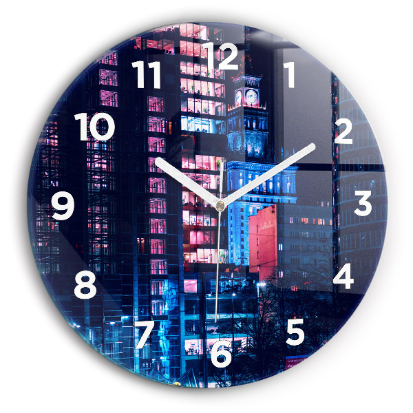 Round glass clock Warsaw at night