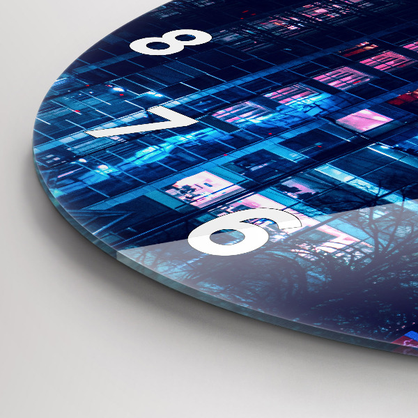 Round glass clock Warsaw at night