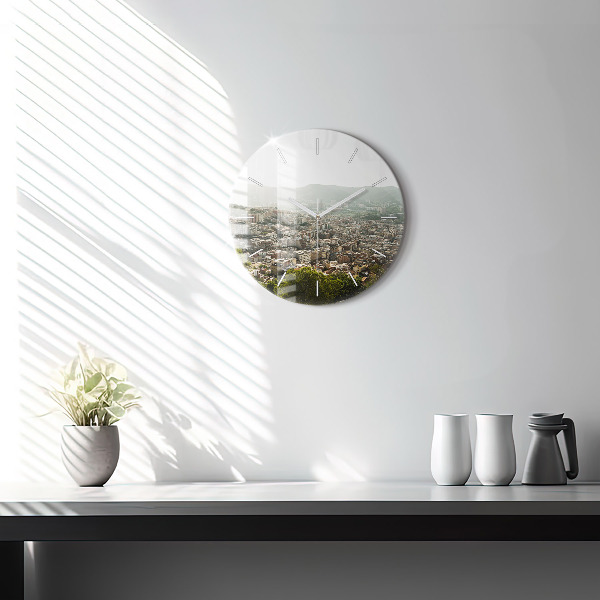 Round glass clock Barcelona view Montjuic