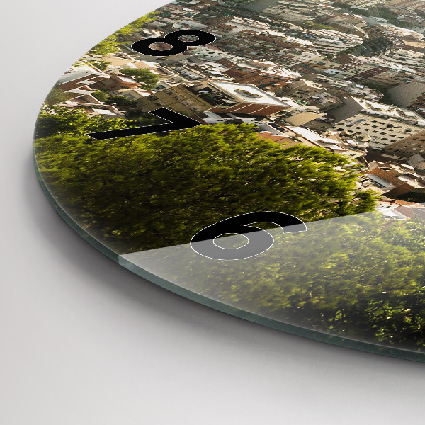 Round glass clock Barcelona view Montjuic