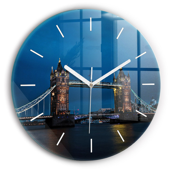 Round glass clock Tower Bridge London at night