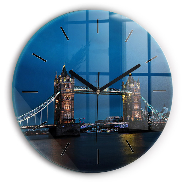 Round glass clock Tower Bridge London at night
