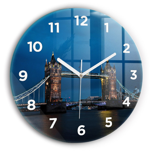 Round glass clock Tower Bridge London at night