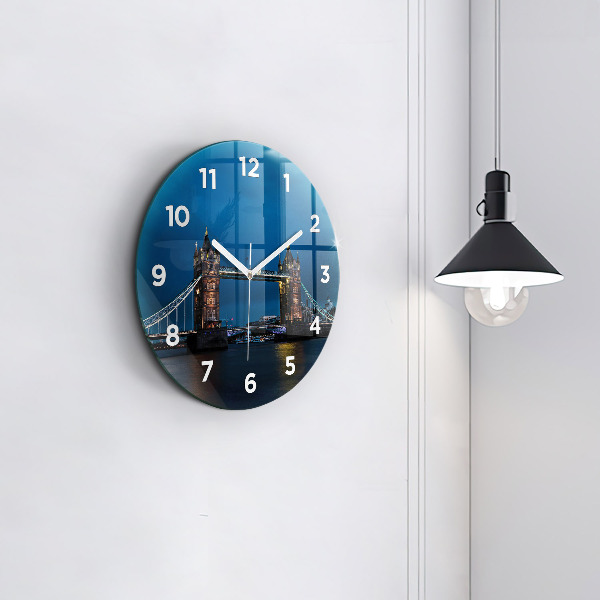 Round glass clock Tower Bridge London at night