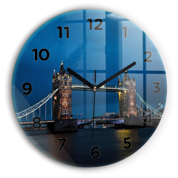 Round glass clock Tower Bridge London at night