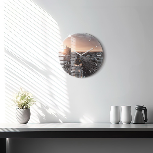 Round glass clock Cities at sunset