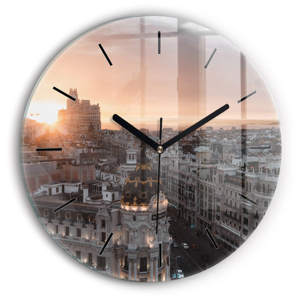 Round glass clock Cities at sunset