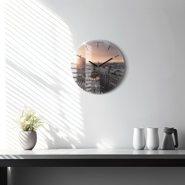 Round glass clock Cities at sunset