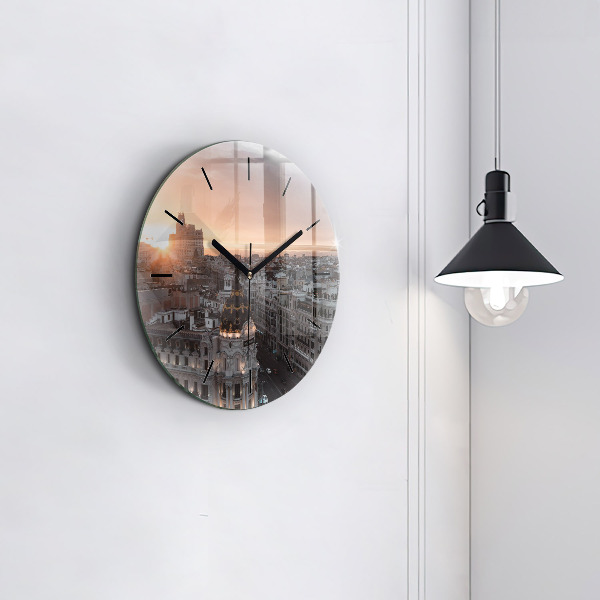 Round glass clock Cities at sunset